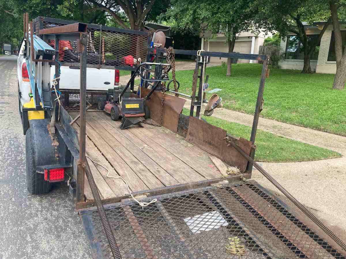 Trailer with mower and tools