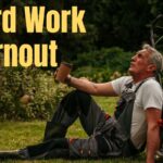 Yard Work Burnout: Why Homeowners Are Ready to Quit Mowing by Fall A contented senior man with white hair and a warm smile sits relaxed in a wooden Adirondack chair in a lush backyard garden, holding a steaming mug of coffee and enjoying a peaceful moment of rest surrounded by green plants and flowers.