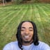 All Bout Motion 24/7 Lawn Care Logo